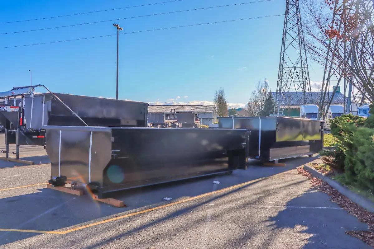 Roll-off dumpster ready for waste disposal at job site for Concrete Dumpster Rental in Chicopee